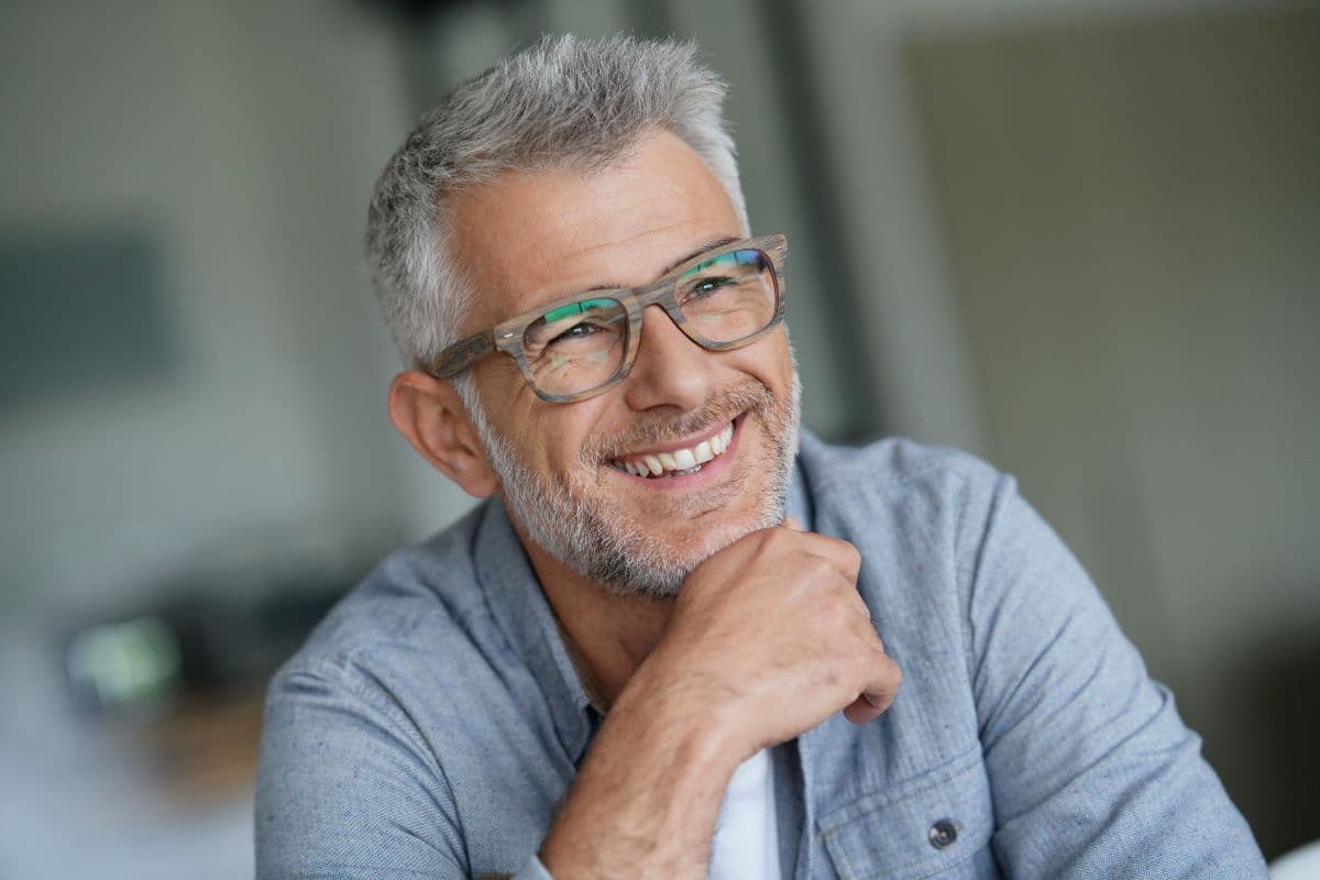 What is crevicular fluid and what can it reveal about implant health?